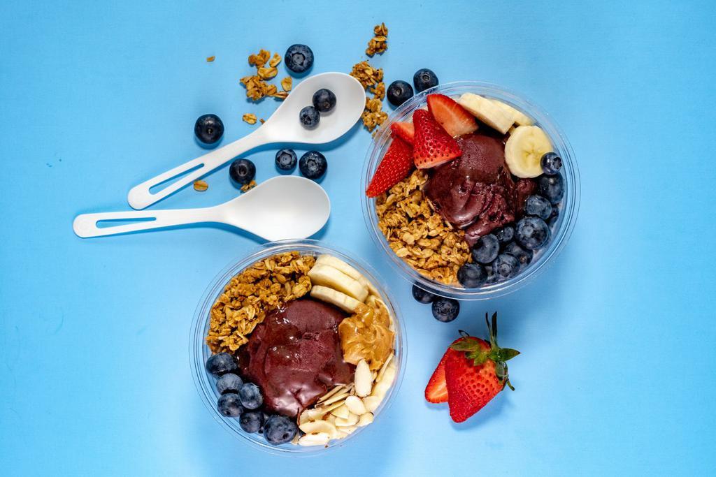 The Nuts · Organic Acai topped with Organic Granola, Fresh Strawberries and Bananas, Peanut Butter, Honey and Coconut