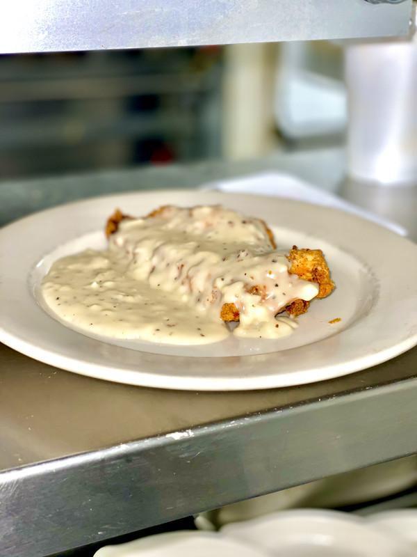 Chicken Fried Steak · Comes with chicken gravy. Served with choice of baked potato or steak cut fries and a side salad.