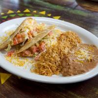 Super Crispy Taco Plate · 2 large fried tacos, fired with lettuce tomatoes and cheese.