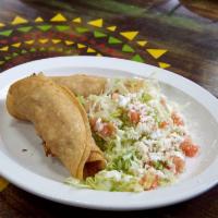 Crispy Roll Taco Plate · 3 deep fried roll tacos topped with lettuce, tomatoes queso fresco and cream.