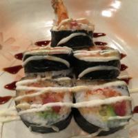 Maru Roll · Tuna, salmon, super white tuna, ebi tempura, avocado, crabmeat, creamy sauce and eel sauce.