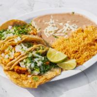 Taco Lunch (Corn Tortilla) · Served with three tacos rice and beans. Served with cilantro and onion.
