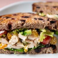 Chicken Salad Sandwich · Traditional chicken, raisins, house mayo, mixed greens, celery, grapes, and blueberry bread.