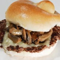 Mushroom Swiss Burger · Ground Steak topped with Swiss cheese and sauteed mushrooms on a hard roll. Served with stea...