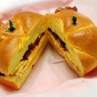 Bacon, Egg and Cheese Sandwich · 2 fried eggs, bacon and American cheese served on a kaiser roll.