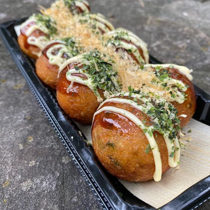 Takoyaki · popular stret food from Osaka with bits of octopus and dough inside a slightly crispy shell, garnished with takoyaki sauce, mayo, bonito flakes, seaweed, and red ginger