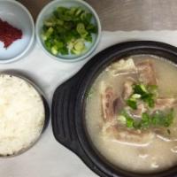 Beef Tendon Soup (우족탕) · Beef tendon in ox bone soup. Comes with a dipping sauce.