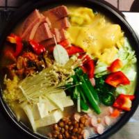 Army base Stew (부대찌개) · Spam, tofu, sausage, ramen, kimchi, green scallion and mushroom. Rice and banchan included.