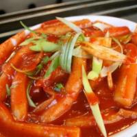 Hot and Spicy Rice Cake (떡복이) · Rice cake, fish cake, boiled egg, vegetables and chili paste. Spicy.