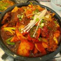 Braised Spicy Beef Short ribs and Oxtail (매운꼬리갈비찜) · Braised. Beef short ribs, oxtails, rice cake, potatos in spicy sauce. (Large size serving 2 ...