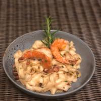 Garlic Noodle Shrimp · Ramen, shrimp, bacon, Parmesan and green onions.