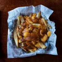 Poutine  · Chips cheese and gravy, Tim Horton’s has nothing on us.