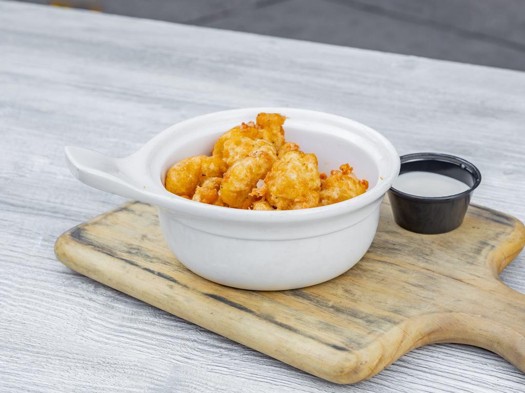 Cheese Curds  · About as Wisconsin as it gets. We beer batter and deep-fry these delicious clock shadow creamery cheese curds and serve them up hot with a side of ranch dressing.
