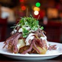 Corned Beef and Cabbage · Guinness braised corned beef, cider braised cabbage and a potato croquette served with a mus...