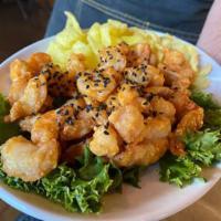 Rock Shrimp · Spicy mayo, sesame seeds, crispy rice noodles.