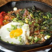 Bibimbap Rice Bowl · Brown rice, spinach, carrots, peppers, shiitake gochujang sauce, fried egg, scallions, cilan...