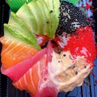 Sushi Donut · Rice donut filled with spicy tuna, topped with salmon and tuna sashimi, avocado, sesame seed...