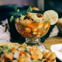 Vuelve a La Vida Cocktail de Mariscos · Shrimp, octopus, scallops, onions, radish, cilantro, tomatoes, lime juice, avocado, in our s...