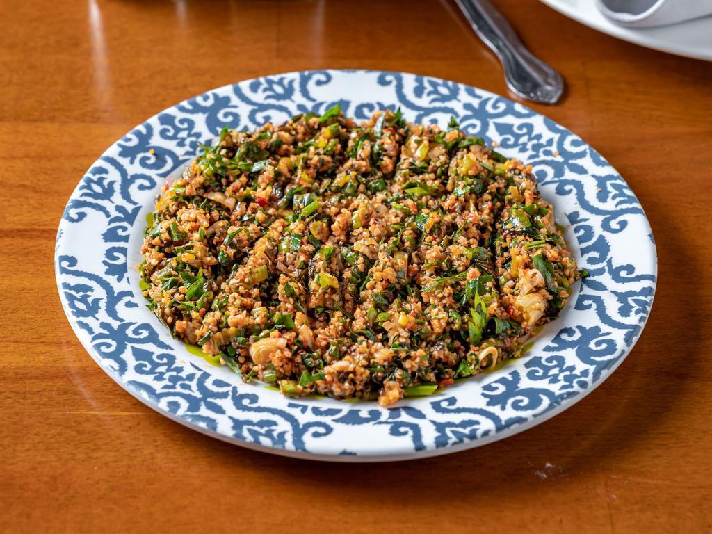 Tabule · A mixture of cracked wheat, parsley, green onions, lettuce and lemon juice.