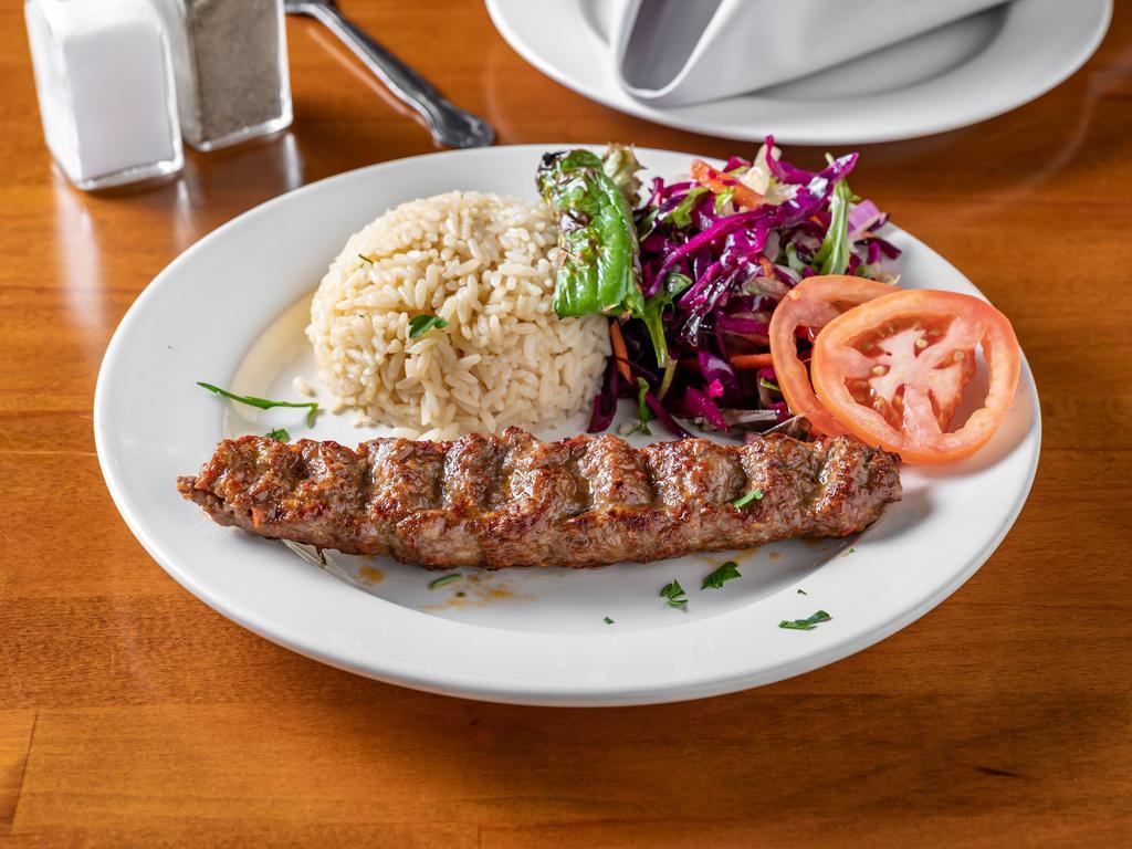 Adana Kebab · Hand chopped meat gently seasoned with red bell pepper and char-grilled on skewers.