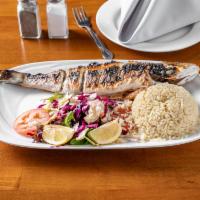 Branzino · Whole branzino grilled of fried served with rice or french fries and green salad.