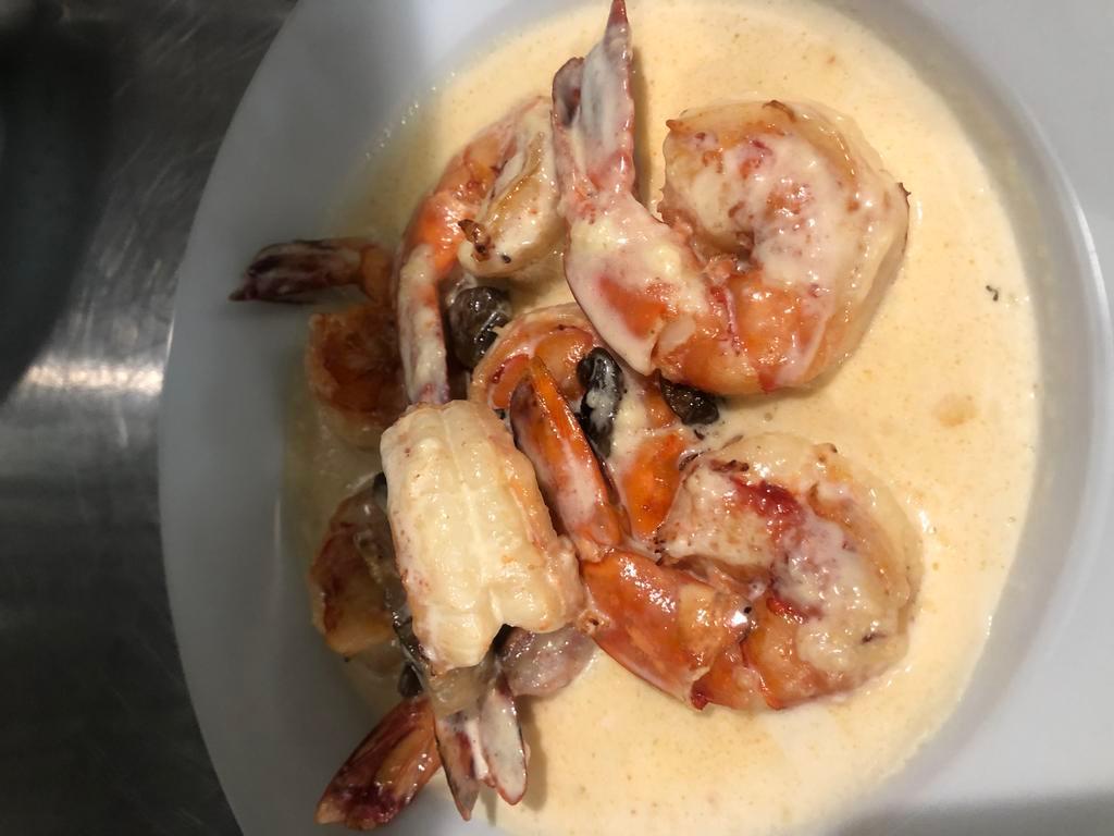 Shrimp in Wine · Shrimp sauteed with mushrooms, in our creamy garlic sauce with white wine.