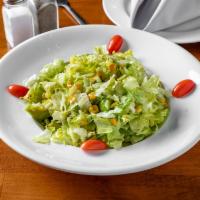 Liman Salad · Chopped lettuce, avocado, corn, olive oil and lemon juice.