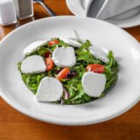 Goat cheese salad · Arugula, cherry tomatoes, red onion, cranberries , goat cheese in our special home made dres...