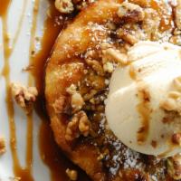 Freshly Baked Apple Pie  · A warm, flaky puff pastry filled with cinnamon apples. Topped with walnuts, caramel sauce an...