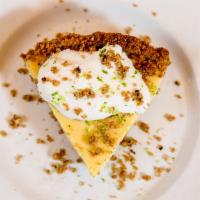 Key Lime Pie · A traditional creamy and tart key lime pie with a graham cracker crust topped with coconut w...
