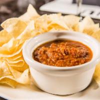 Chips & Salsa · Warm tortilla chips and oven roasted salsa.