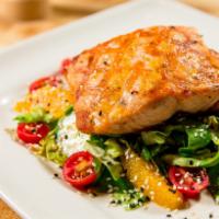 Grilled Salmon Salad · Fresh, responsibly sourced salmon in a Miso Ginger Dressing over butter lettuce with cherry ...