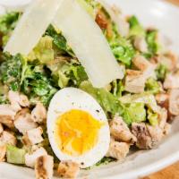 Chopped Grilled Chicken Caesar · Crisp romaine chopped and tossed with hot, wood grilled chicken and Hailey’s croutons in a z...