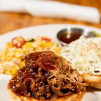 12 Hour Pulled Pork Sandwich · Slow roasted, Memphis-style pulled pork in our signature BBQ sauce with creamy slaw and pick...