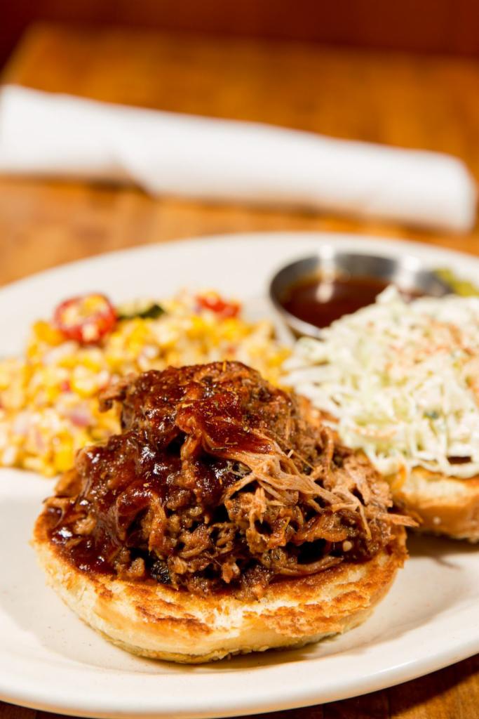 12 Hour Pulled Pork Sandwich · Slow roasted, Memphis-style pulled pork in our signature BBQ sauce with creamy slaw and pickles.