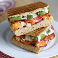 Turkey Bacon Avocado Panini - Full · Turkey breast, turkey bacon, cheddar cheese, avocado, tomato, red onion, low-fat ranch dress...