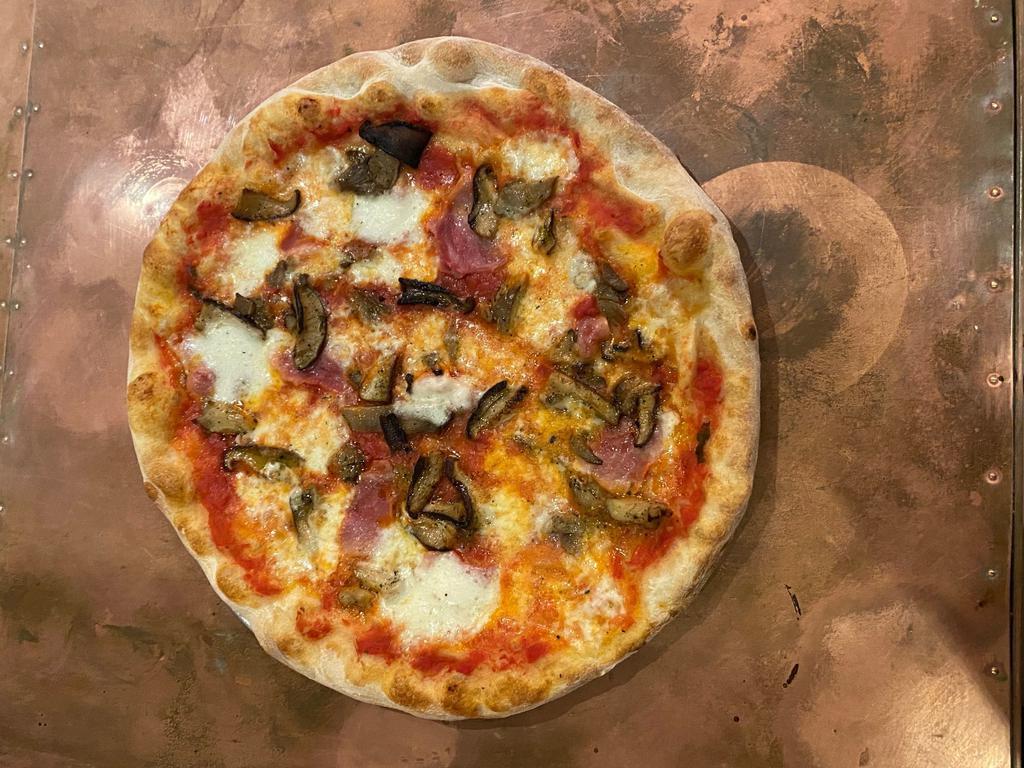 Pizza  Funghi e Salsiccia ·  spicy Italian sausage, wild mushrooms, tomato sauce and combining it all with mozzarella Fior di Latte