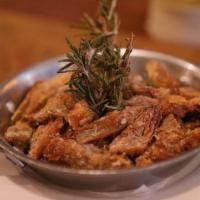 Carciofi Fritti · Pan-fried baby artichokes tossed with rosemary and Parmigiano cheese.