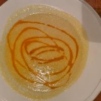 Vellutata Di Zucchini · Smooth zucchini & saffron sup topped with sundried tomato oil.