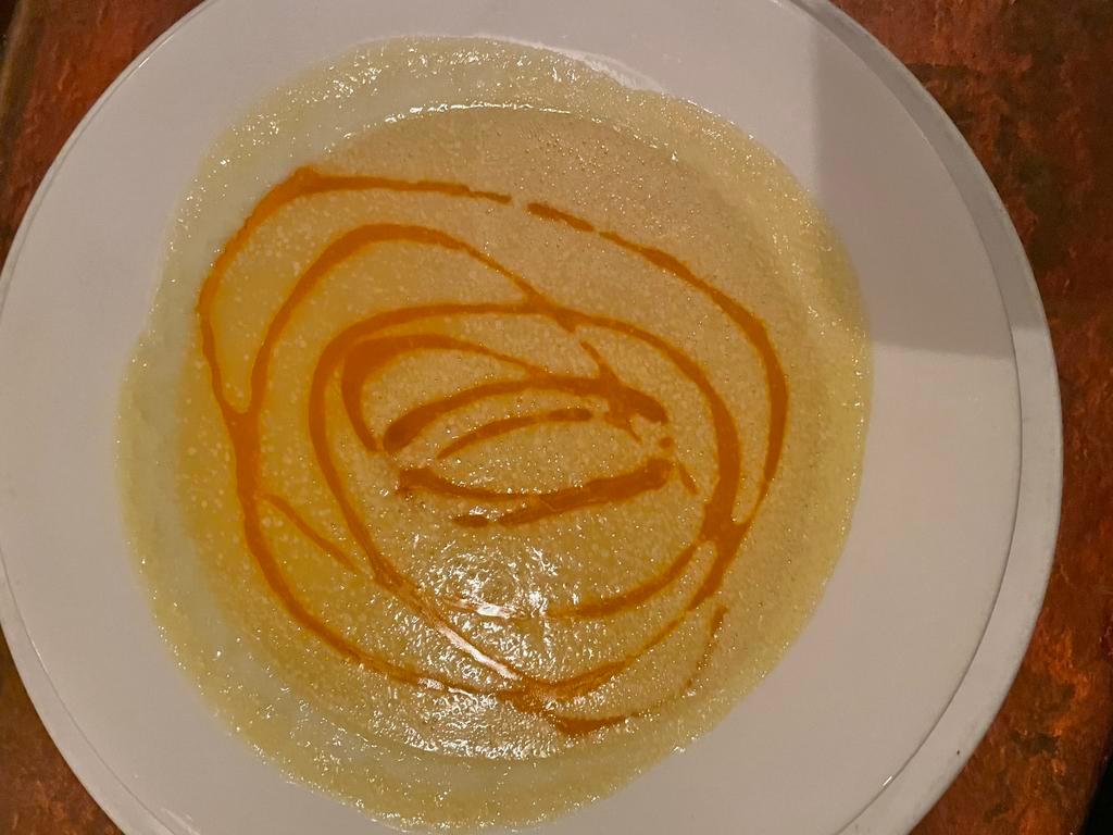 Vellutata Di Zucchini · Smooth zucchini & saffron sup topped with sundried tomato oil.