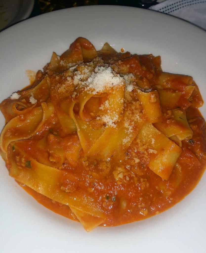 Pappardelle al Ragu di Vitello · Home made pasta ribbons sauteed with a ragout of veal and montasio cheese.