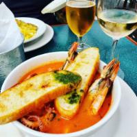 Brodetto di Pesce · Head of shrimp, scallops, octopus & white fish cooked in a savory white wine& tomato broth s...