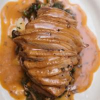 Petto d'anatra · Pan seared breast of duck in a thyme sauce served with sauteed oyster mushrooms, spinach and...