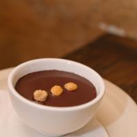 Baci mousse · Chocolate and hazelnut mousse topped with chocolate sauce and toasted hazelnut 