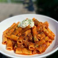 Nonna's Ragu · rigatoni, slow-cooked lamb sausage & beef sauce, topped with whipped ricotta