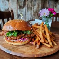 Southern Fried Chicken Sandwich · country fried chicken, lemon basil aioli, red cabbage, rocket greens, side of fries.