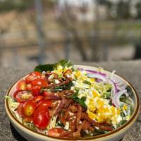 Farmer's Cobb · field greens, tomato, bacon, red onion, aged cheddar, boiled egg, dill ranch