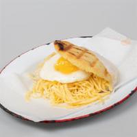 Girasol Arepa · Fried egg (over easy, medium or hard) with shredded yellow cheese.