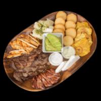 Parrilla Mixta Bocas Grill · 12 oz. Picanha on the grill, 8 oz. chicken, 1 sausage, fried green plantains, yuca, guasacac...