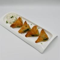 Spinach Pie Appetizer · Filo pastry stuffed with spinach, dill, diced onions, Feta cheese, and baked golden.